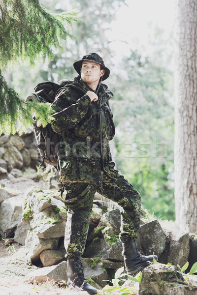 young soldier with backpack in forest Stock photo © dolgachov