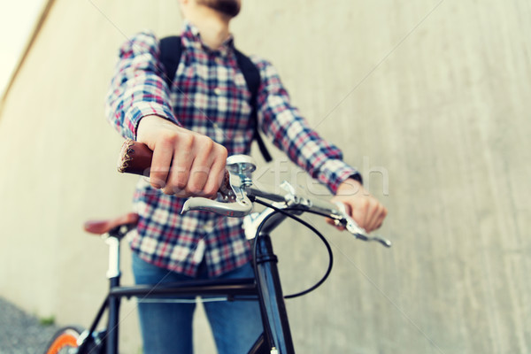 Homme fixé engins vélo sac à dos [[stock_photo]] © dolgachov