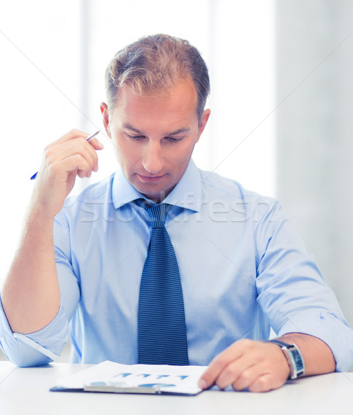 businessman writing in notebook Stock photo © dolgachov