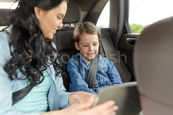 happy family with tablet pc driving in car Stock photo © dolgachov