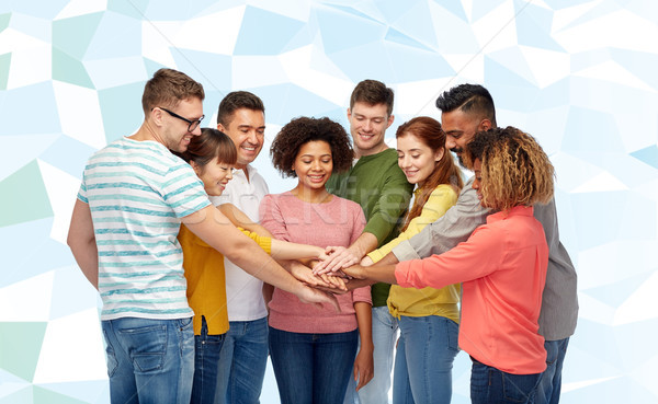 international group of happy people holding hands Stock photo © dolgachov