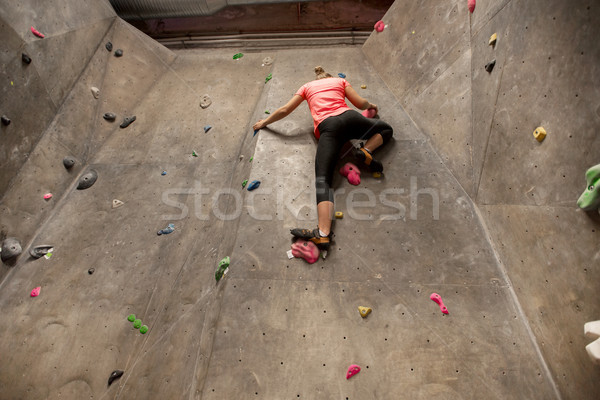 young woman exercising at indoor climbing gym Stock photo © dolgachov