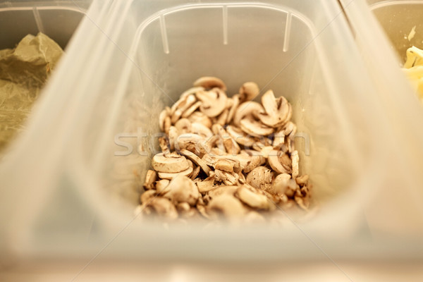 container with champignons at restaurant kitchen Stock photo © dolgachov