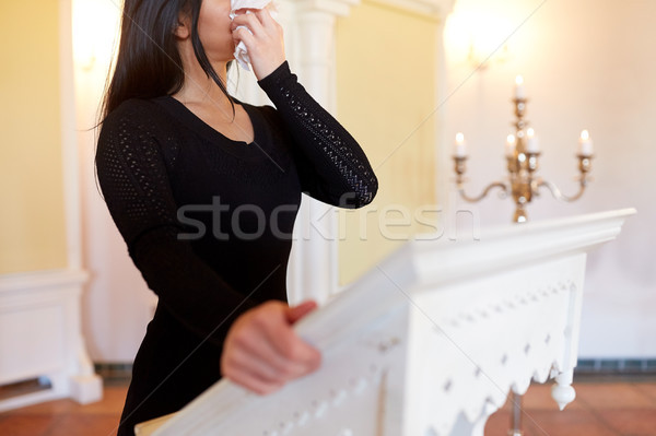woman with wipe crying at funeral in church Stock photo © dolgachov