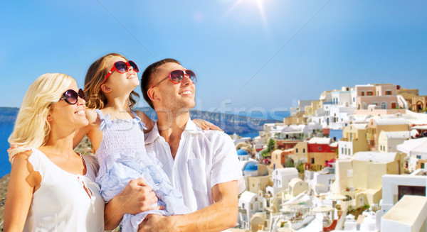 Stock photo: happy family over santorini island background