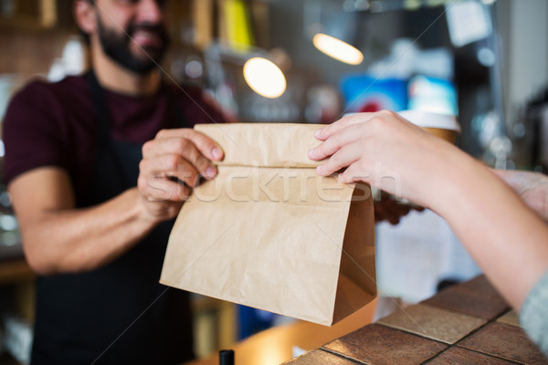 man or bartender serving customer at coffee shop Stock photo © dolgachov