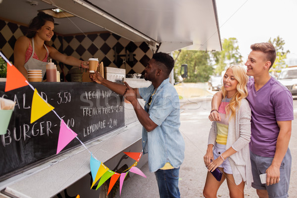 happy customers queue at food truck Stock photo © dolgachov