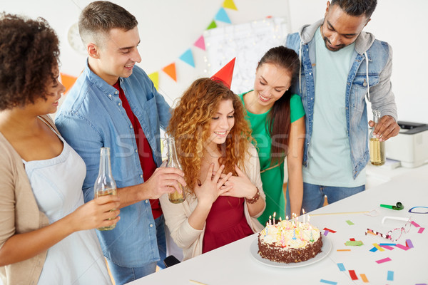 Stock photo: happy coworkers with cake at office birthday party