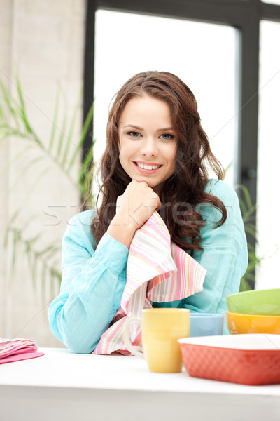 lovely housewife at the kitchen Stock photo © dolgachov