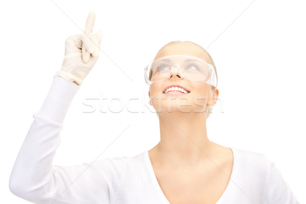 woman in protective glasses and gloves Stock photo © dolgachov