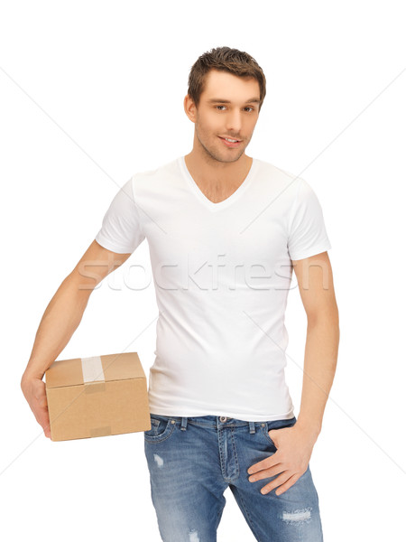 man in white shirt with parsel Stock photo © dolgachov