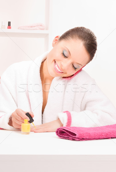 woman polishing her nails Stock photo © dolgachov