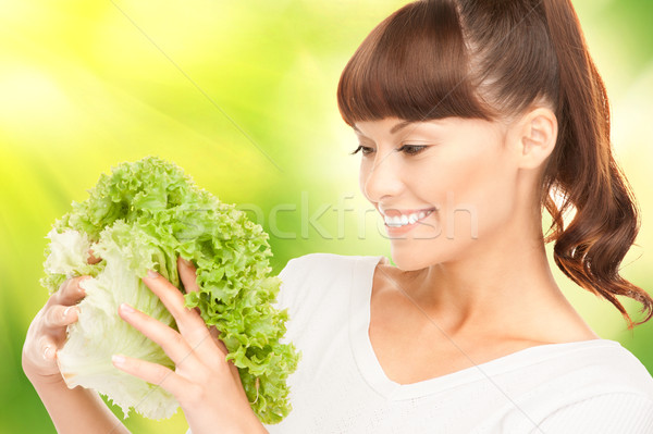 beautiful housewife with lettuce Stock photo © dolgachov