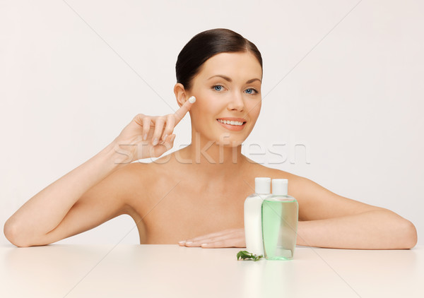 beautiful woman with moisturizing creme drop Stock photo © dolgachov