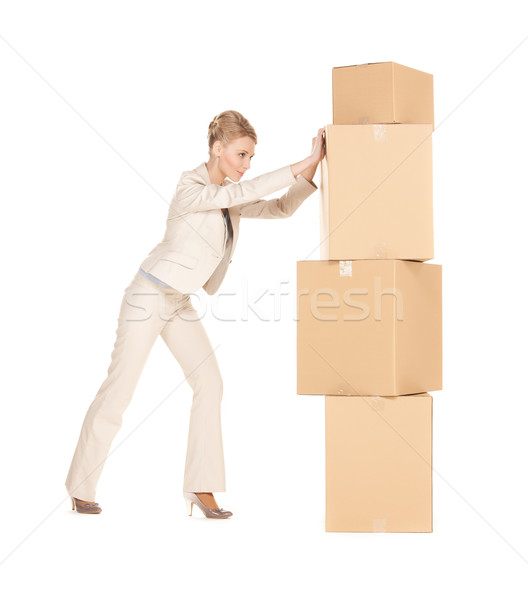 businesswoman moving big boxes Stock photo © dolgachov