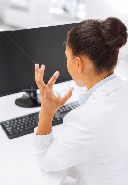 stressed businesswoman with computer Stock photo © dolgachov