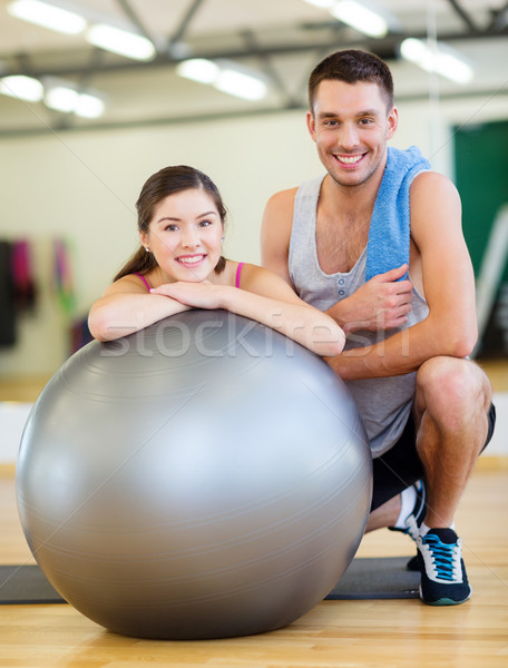 two smiling people with fitness ball Stock photo © dolgachov