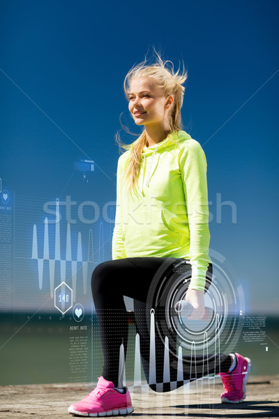 sporty woman with light dumbbells outdoors Stock photo © dolgachov