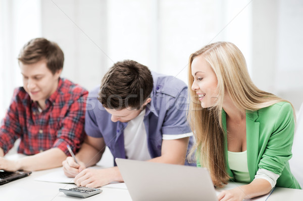 students writing test or exam in lecture at school Stock photo © dolgachov