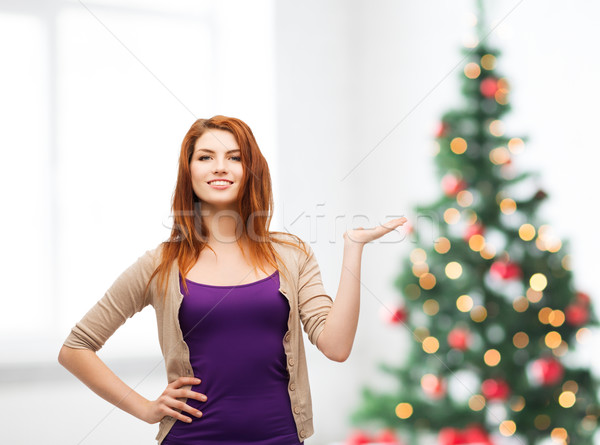 Souriant adolescente quelque chose Palm hiver [[stock_photo]] © dolgachov