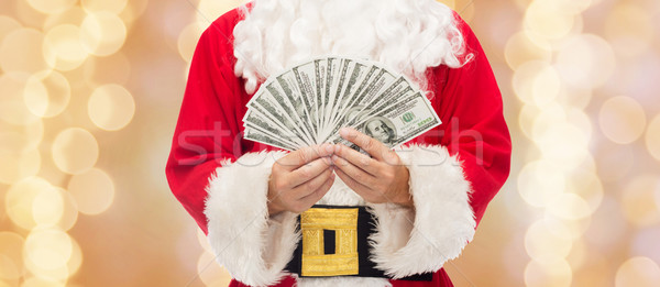 Stock photo: close up of santa claus with dollar money