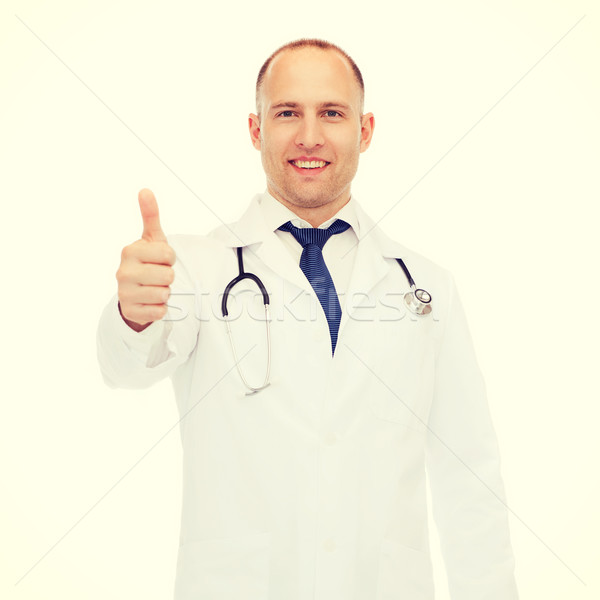 smiling doctor with stethoscope showing thumbs up Stock photo © dolgachov