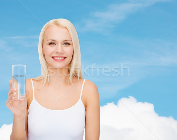 Fiatal mosolygó nő üveg víz egészség szépség Stock fotó © dolgachov