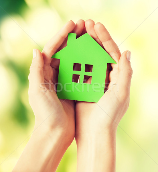 hands holding green house Stock photo © dolgachov