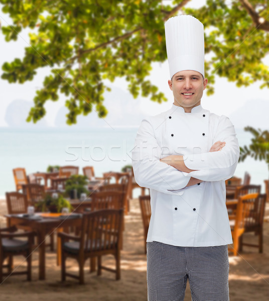 happy male chef cook with crossed hands Stock photo © dolgachov