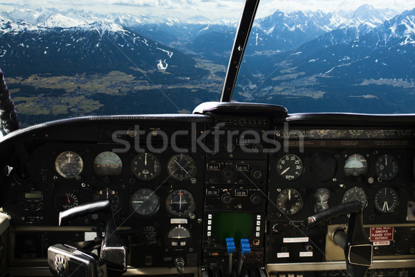 dashboard in airplane cockpit and mountains view Stock photo © dolgachov