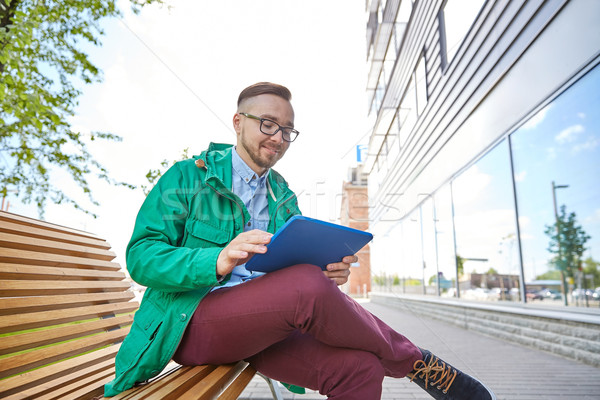 happy young hipster man with tablet pc and bike Stock photo © dolgachov