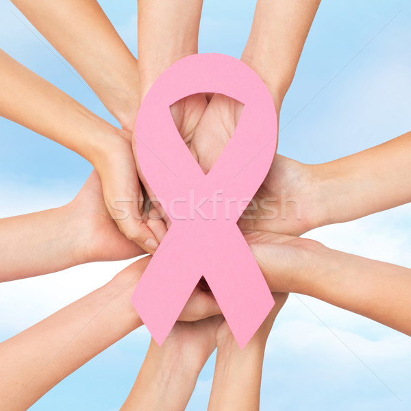 close up of hands with cancer awareness symbol Stock photo © dolgachov