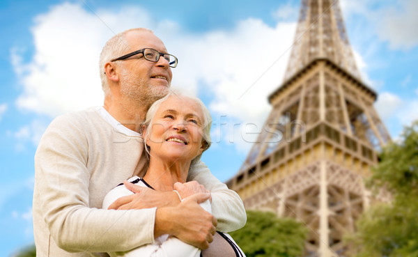 Stock photo: happy senior couple over paris eiffel tower