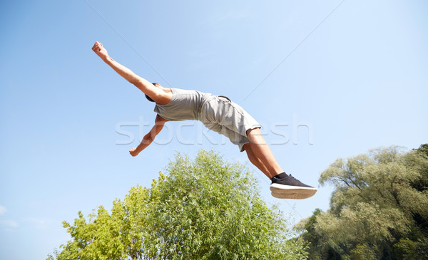 [[stock_photo]]: Jeune · homme · sautant · été · parc · fitness