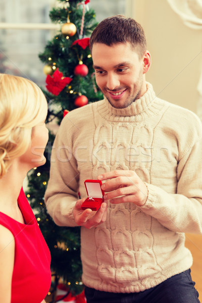 romantic man proposing to a woman Stock photo © dolgachov