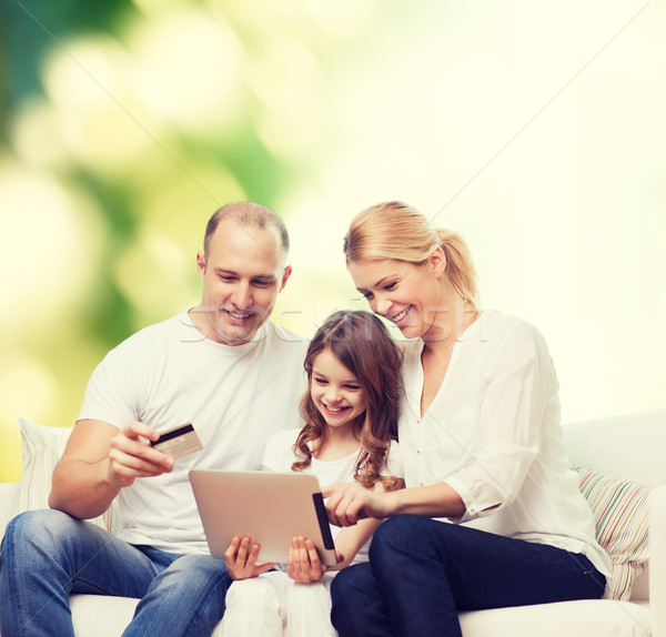 happy family with tablet pc and credit card Stock photo © dolgachov