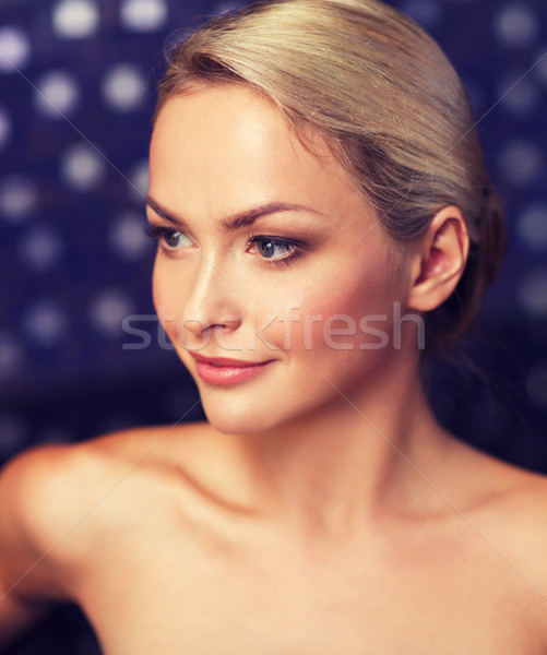 close up of young woman sitting in bath towel Stock photo © dolgachov