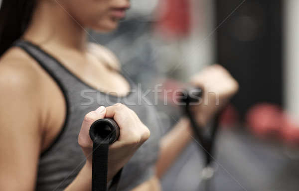 close up of woman exercising on gym machine Stock photo © dolgachov