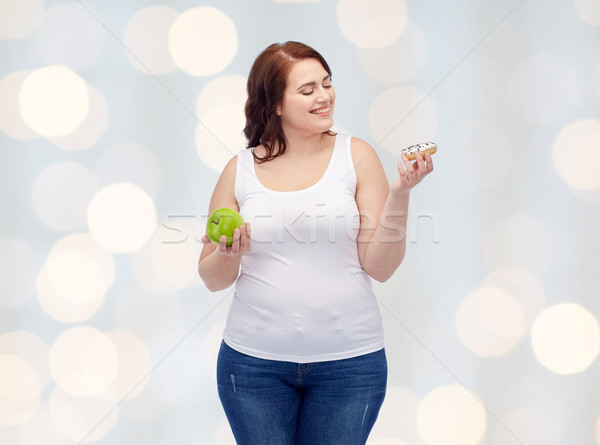 Boldog plus size nő választ alma fánk Stock fotó © dolgachov