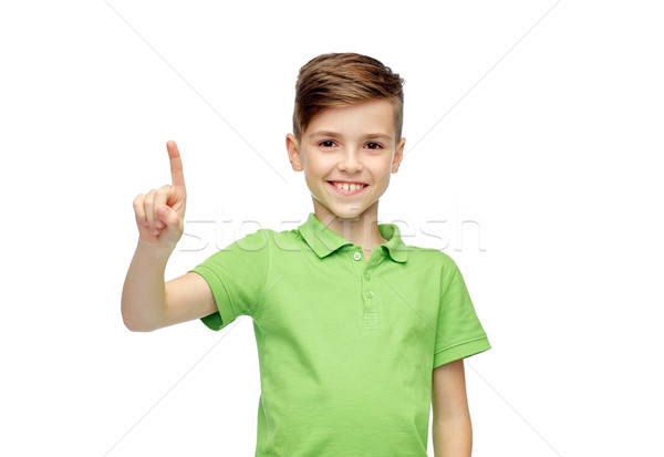 happy boy in green polo t-shirt pointing finger up Stock photo © dolgachov