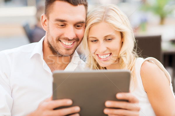 happy couple with tablet pc at restaurant lounge Stock photo © dolgachov