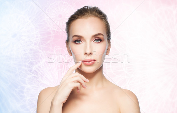 beautiful young woman showing her lips Stock photo © dolgachov