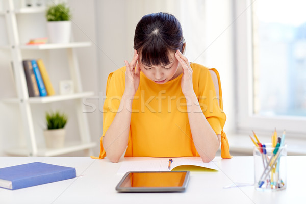 tired asian woman student with tablet pc at home Stock photo © dolgachov
