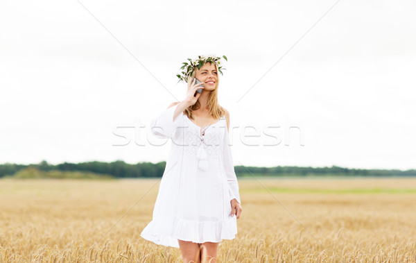 happy young woman calling on smartphone at country Stock photo © dolgachov