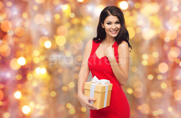 beautiful sexy woman in red dress with gift box Stock photo © dolgachov