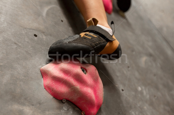 foot of woman exercising at indoor climbing gym Stock photo © dolgachov