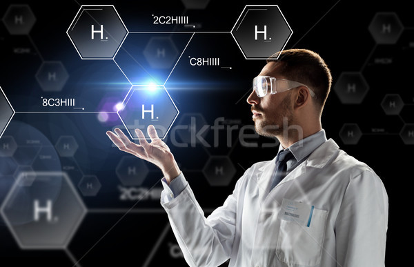 scientist in lab goggles chemical formula Stock photo © dolgachov