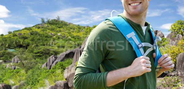 close up of happy man with backpack traveling Stock photo © dolgachov