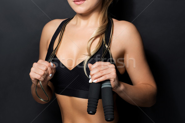 close up of sporty woman with jumping rope Stock photo © dolgachov