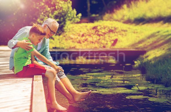 Grand-père petit-fils séance rivière famille génération [[stock_photo]] © dolgachov